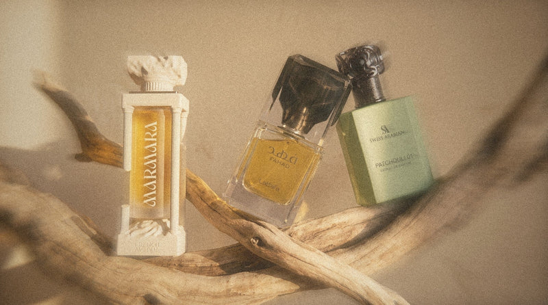 French Avenue Marmara, Lattafa Fahad and Swiss Arabian Patchouli 01 on driftwood in golden light